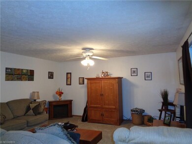GREAT ROOM  WITH CEILING FAN NEWER CARPET