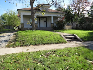 View of front of home featuring a porch and a fron