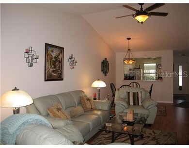 Living Room - Vaulted ceiling and nice ceiling fan with light.