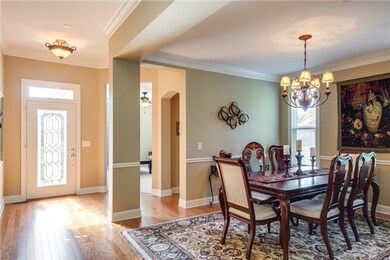 Upgraded beautiful front glass panel door takes you into dramatic opening of living space with upgraded wood trim work throughout. Home office/ study or possible 4th bedroom ? Powder room and formal dining room.  