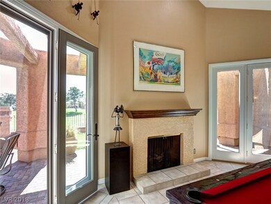 Living room with gas fireplace, recessed lighting,