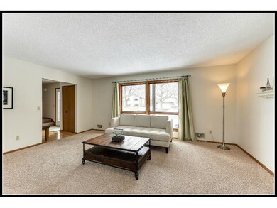 A large picture window in the front living room le