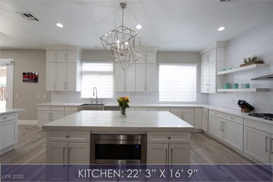 Kitchen featuring a kitchen island, stainless stee