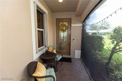 Doorway to property featuring stucco siding