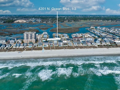 Birds eye view of property with a water view and a