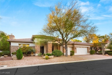 View of front of home with an attached garage, con