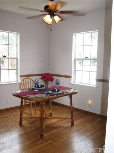 Formal dining room with plenty of natural light.