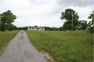 Spacious inside and out. Surrounded by 5 aces of level and rolling land.