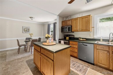 Kitchen with center island and appliances with sla
