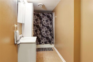 Spacious bathroom with storage.
