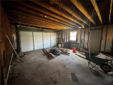 attached double car garage w/recently installed garage door- ready for renovation