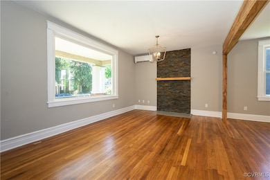 Living room featuring a wall mounted air condition