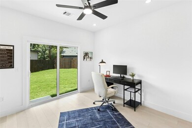 Home office featuring wood finished floors, ceili