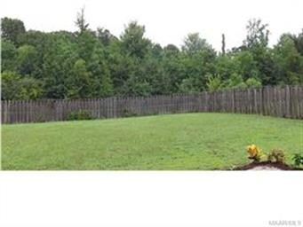A very private yard with woods behind the house.  