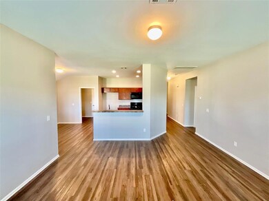 Kitchen featuring hardwood / wood-style flooring a