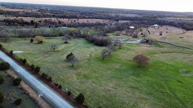 Birds eye view of property featuring a rural view