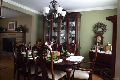 Dining room with gleaming hard wood floors.