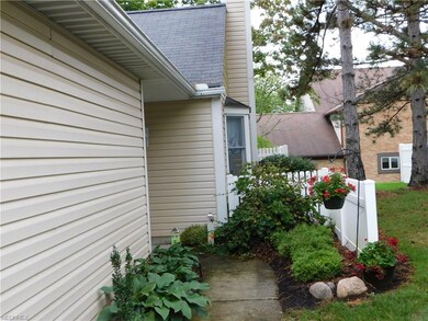 Private side entry accented by perennial beds and 