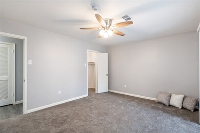 The primary suite is spacious with fresh carpet an