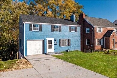 Exterior Front showing new oversized concrete driveway