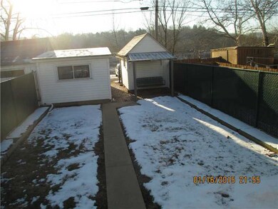 Exterior Front. Vintage 1 car  garage with brick f