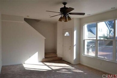 Large Family room with plenty of sunshine and a ce