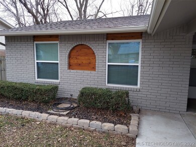 New decorative stained wood in brick arch and abov