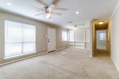 Foyer entrance featuring ornamental molding, recessed lighting, light carpet, and ceiling fan