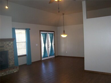 Patio doors in dining area lead out to the pool ar