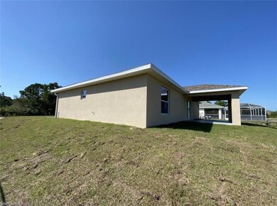View of property exterior with stucco siding and a lawn