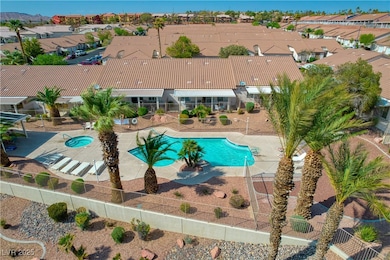 Community pool featuring fence, a patio area, and