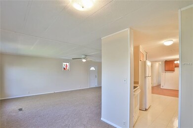 Large living space with new neutral carpeting