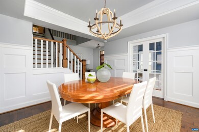 Two story foyer opens into a dining room with floo