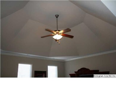Cathedral ceiling in Greatroom with ceiling fan.