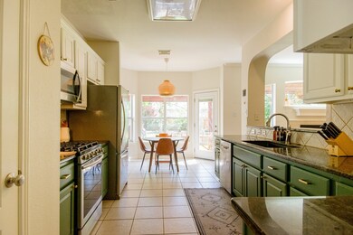 This bright kitchen features modern appliances, am