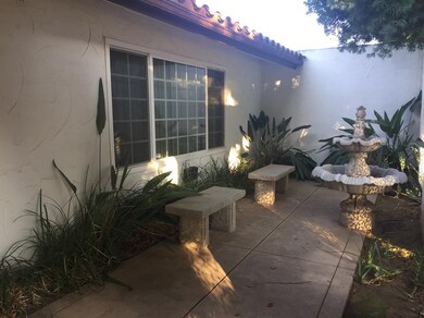 Front court year with fountain and benches