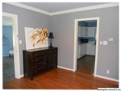 A view of the foyer from the front door.  The sunr