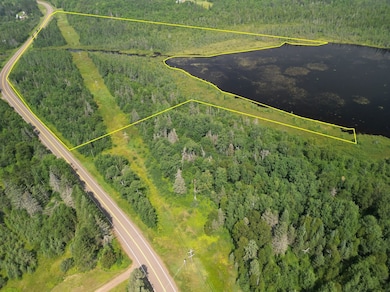 View of property location with property parcel outlined and a large body of water