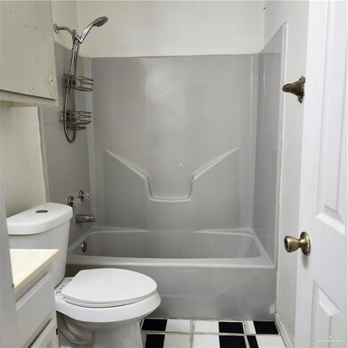 Bathroom featuring vanity and bathing tub / shower combination