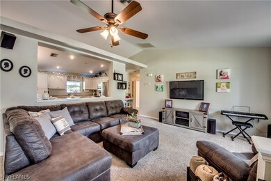Living room perfect for lounging and enjoying movies, wired for surround sound.