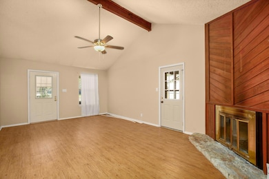 Unfurnished living room featuring a glass covered