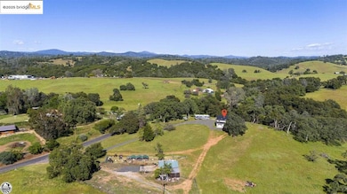 Birds eye view of property with a rural view