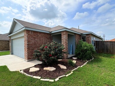 Single story home featuring a front lawn, a garag