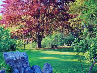 Yard/Garden. Yard & gardens with mature trees and