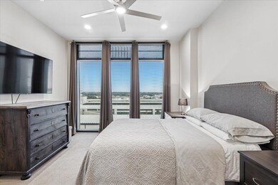Bedroom with light carpet, recessed lighting, a ce