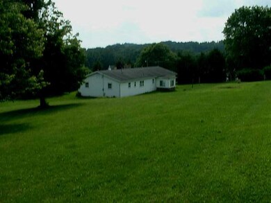 Exterior Back. Almost 1.5 Acres surrounded by Beau