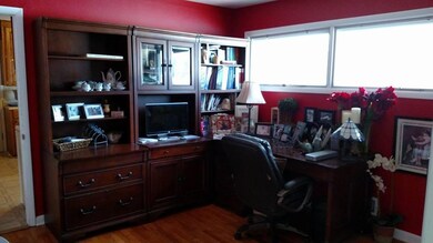 This bedroom is currently being used as a home office. 