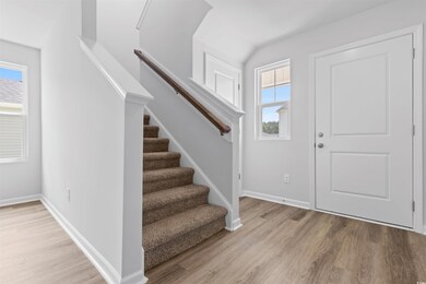 Foyer entrance with light hardwood / wood-style flooring