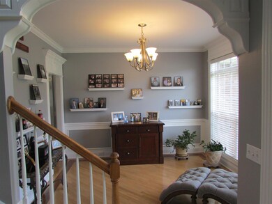 Formall Dining room with nice trim package, currently being used as reading or sitting area