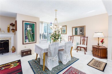 Dining room showing wood burning fireplace.  Condo